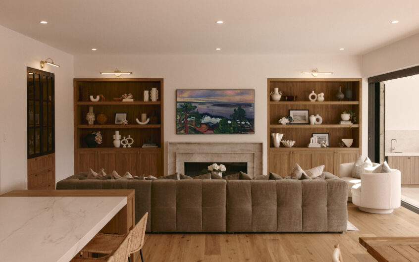 custom timber shaker style cabinetry in open concept living wall joinery beside fireplace